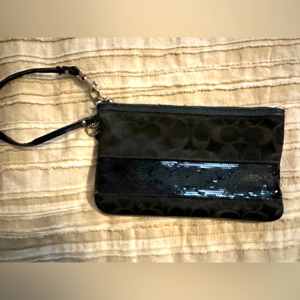 Coach wristlet with black sequin detail